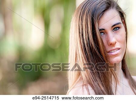 A smiling 22 year old woman with long hair smiling at the camera. View Large Photo Image Stock Photography - A smiling 22 year old woman with long hair smiling at the camera.. Fotosearch
