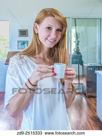 A woman prepares to sip her coffee. View Large Photo Image Stock Image - A woman prepares to sip her coffee.. Fotosearch