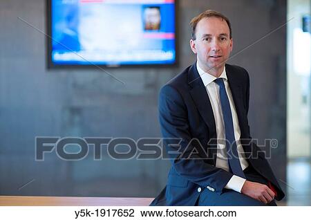 Almere, Netherlands. 23rd floor of an office-building. Portrait of a man in suit, working as a marketing manager for a cooperation. View Large Photo Image Stock Image - Almere, Netherlands. 23rd floor of an office-building. Portrait of a man in suit, working as a marketing manager for a cooperation.. Fotosearch