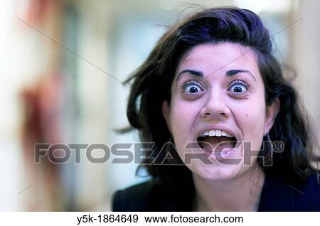 Stock Photo - Amsterdam Airport, Amsterdam, Netherlands Young Italian woman during a conversation. Fotosearch