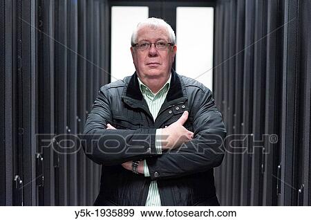 Stock Photo - Amsterdam, Netherlands. Portrait of a man at a datacentre for internet traffic.. Fotosearch
