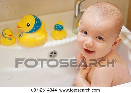 Baby Boy and Yellow Duck... View Large Photo Image Picture - Baby Boy and Yellow Duck.... Fotosearch