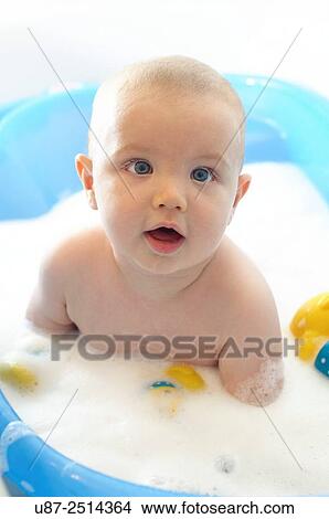Picture - Baby Boy and Yellow Duck. Fotosearch