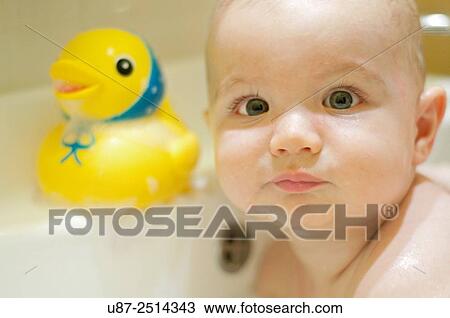 Baby Boy and Yellow Duck... View Large Photo Image Stock Image - Baby Boy and Yellow Duck.... Fotosearch