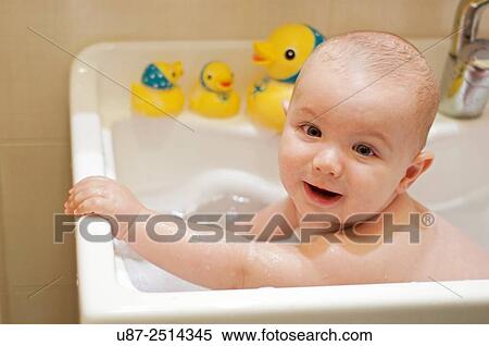 Baby Boy and Yellow Duck... View Large Photo Image Stock Photography - Baby Boy and Yellow Duck.... Fotosearch