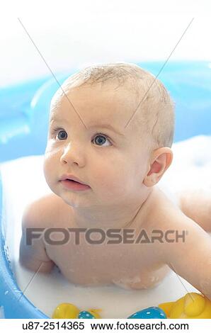Stock Photography - Baby Boy and Yellow Duck. Fotosearch