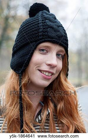 Breda, Netherlands. Young, fashionable and redheaded woman in a city-park. View Large Photo Image Stock Image - Breda, Netherlands. Young, fashionable and redheaded woman in a city-park.. Fotosearch