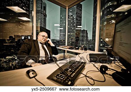 Stock Photo - Businessman talking on the phone.. Fotosearch