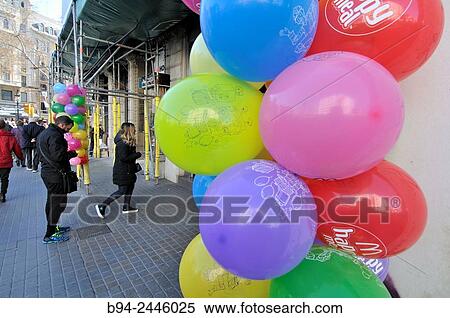 Colorful balloons on the street. Barcelona. Catalonia. Spain. View Large Photo Image Stock Photography - Colorful balloons on the street. Barcelona. Catalonia. Spain.. Fotosearch