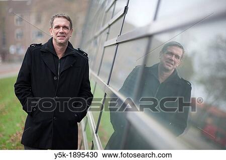 Delft, Netherlands. A man in suit, being a researcher on a university, portrayed for a magazine. View Large Photo Image Stock Image - Delft, Netherlands. A man in suit, being a researcher on a university, portrayed for a magazine.. Fotosearch