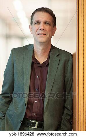 Stock Photo - Delft, Netherlands. A man in suit, being a researcher on a university, portrayed for a magazine.. Fotosearch