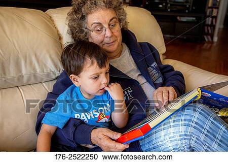Grandmother reading to/with her 3 year old grandson, MR# 6302 and 4709. View Large Photo Image Stock Image - Grandmother reading to/with her 3 year old grandson, MR# 6302 and 4709.. Fotosearch