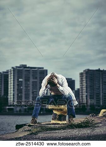 Handsome man wearing white shirt and jeans, windy day in harbour. View Large Photo Image Stock Image - Handsome man wearing white shirt and jeans, windy day in harbour.. Fotosearch