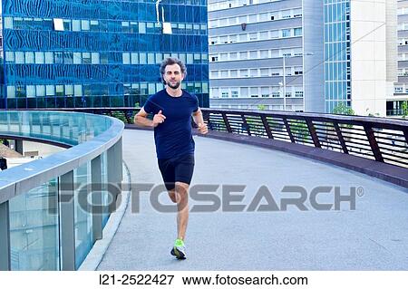 Male runner on urban street, man playing sports in the city, man running outdoor. Barcelona, Catalonia, Spain. View Large Photo Image Stock Photo - Male runner on urban street, man playing sports in the city, man running outdoor. Barcelona, Catalonia, Spain.. Fotosearch