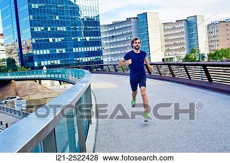 Male runner on urban street, man playing sports in the city, man running outdoor. Barcelona, Catalonia, Spain. View Large Photo Image Stock Photo - Male runner on urban street, man playing sports in the city, man running outdoor. Barcelona, Catalonia, Spain.. Fotosearch