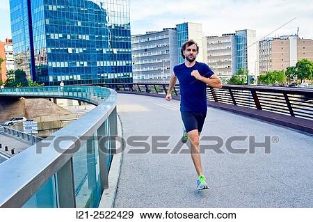 Male runner on urban street, man playing sports in the city, man running outdoor. Barcelona, Catalonia, Spain. View Large Photo Image Stock Photo - Male runner on urban street, man playing sports in the city, man running outdoor. Barcelona, Catalonia, Spain.. Fotosearch