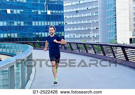 Male runner on urban street, man playing sports in the city, man running outdoor. Barcelona, Catalonia, Spain. View Large Photo Image Stock Photograph - Male runner on urban street, man playing sports in the city, man running outdoor. Barcelona, Catalonia, Spain.. Fotosearch