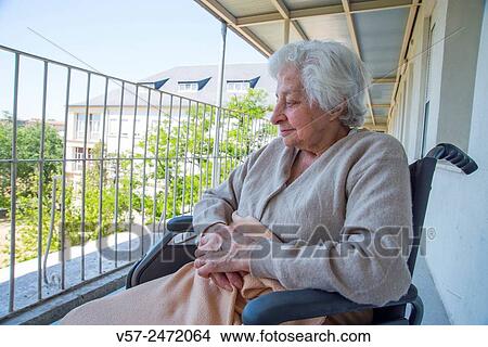 Old woman in a nursing home, sitting in a wheelchair. View Large Photo Image Picture - Old woman in a nursing home, sitting in a wheelchair.. Fotosearch