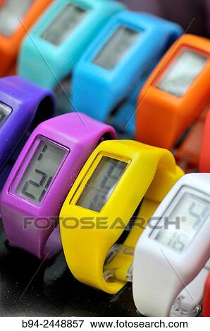 Plastic watches in different colors for sale View Large Photo Image Stock Photo - Plastic watches in different colors for sale. Fotosearch