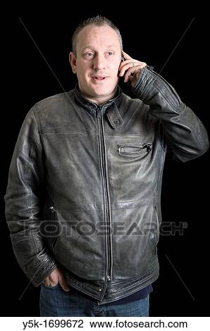 Portrait of a construction superintendent, with his mobile phone, before a black background. Photograph - portrait taken during the reconstruction of a bathroom. View Large Photo Image Stock Image - Portrait of a construction superintendent, with his mobile phone, before a black background. Photograph - portrait taken during the reconstruction of a bathroom.. Fotosearch