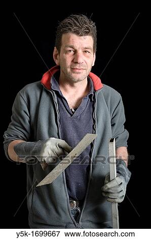 Portrait of a plasterer, with his tools, before a black background. Photograph - portrait taken during the reconstruction of a bathroom. View Large Photo Image Stock Photo - Portrait of a plasterer, with his tools, before a black background. Photograph - portrait taken during the reconstruction of a bathroom.. Fotosearch