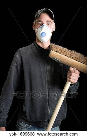 Portrait of a sweeper, with his broom and mouth-cap or mask, before a black background. Photograph - portrait taken during the reconstruction of a bathroom. View Large Photo Image Stock Photo - Portrait of a sweeper, with his broom and mouth-cap or mask, before a black background. Photograph - portrait taken during the reconstruction of a bathroom.. Fotosearch