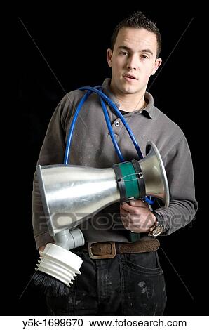 Portrait of a ventilation specialist, with his tools, before a black background. Photograph - portrait taken during the reconstruction of a bathroom. View Large Photo Image Stock Image - Portrait of a ventilation specialist, with his tools, before a black background. Photograph - portrait taken during the reconstruction of a bathroom.. Fotosearch