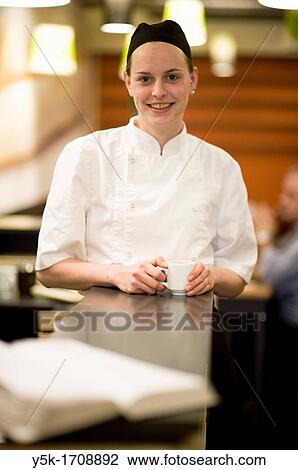 Stock Image - Portrait of a young, female chef.. Fotosearch