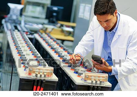 Stock Image - Researcher. Classic Solar Batteries. Solar Liquid Cell. Technological research on energy. Energy and Environment. Tecnalia Research & innovation, Bizkaia, Basque Country, Spain.. Fotosearch