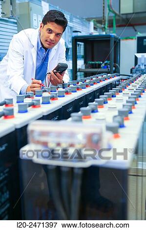 Stock Photo - Researcher. Classic Solar Batteries. Solar Liquid Cell. Technological research on energy. Energy and Environment. Tecnalia Research & innovation, Bizkaia, Basque Country, Spain.. Fotosearch