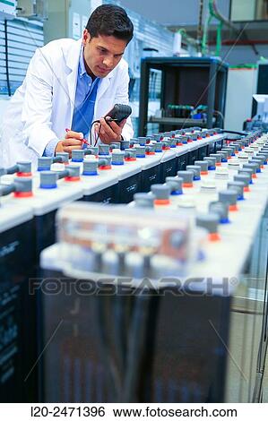 Stock Photograph - Researcher. Classic Solar Batteries. Solar Liquid Cell. Technological research on energy. Energy and Environment. Tecnalia Research & innovation, Bizkaia, Basque Country, Spain.. Fotosearch