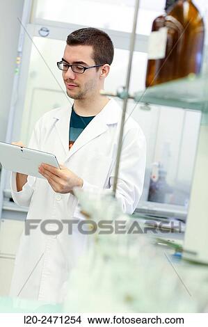 Picture - Researcher. Disaggregation and sample preparation arid steel, for further analysis determination of oxides, Laboratory, Research on building materials, Tecnalia Research & Innovation, Zamudio, Bizkaia, Basque Country, Spain. Fotosearch