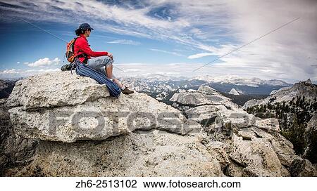 Rock climber on the summit of Tenaya Peak, Tuolumne Meadows, Yosemite National Park, California USA. View Large Photo Image Stock Image - Rock climber on the summit of Tenaya Peak, Tuolumne Meadows, Yosemite National Park, California USA.. Fotosearch