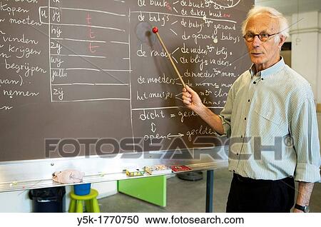 Rotterdam, Netherlands. A retired language teacher volunteers to educate undocumented aliens in The Netherlands into the Dutch Language. View Large Photo Image Stock Image - Rotterdam, Netherlands. A retired language teacher volunteers to educate undocumented aliens in The Netherlands into the Dutch Language.. Fotosearch