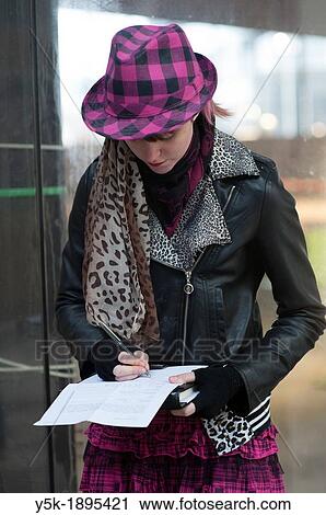Rotterdam, Netherlands. Portrait of a young, female photographer on the Rotterdam tuesday-market. View Large Photo Image Stock Image - Rotterdam, Netherlands. Portrait of a young, female photographer on the Rotterdam tuesday-market.. Fotosearch