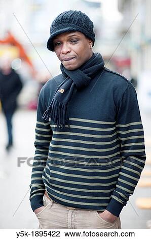 Stock Image - Rotterdam, Netherlands. Street-portrait if a young, black immigrant from Portugal.. Fotosearch