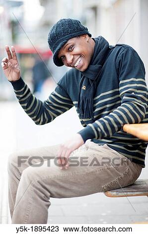 Rotterdam, Netherlands. Street-portrait if a young, black immigrant from Portugal. View Large Photo Image Stock Image - Rotterdam, Netherlands. Street-portrait if a young, black immigrant from Portugal.. Fotosearch