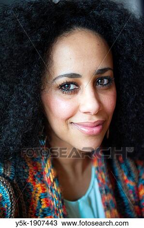 Rotterdam, Netherlands. Young African woman smiling into the camera. Headshot and portrait. View Large Photo Image Stock Image - Rotterdam, Netherlands. Young African woman smiling into the camera. Headshot and portrait.. Fotosearch