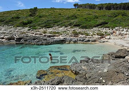 Stock Image - small beach of Perna inlet, Palmizana, St Clement island, Hell´s Islands Pakleni, Hvar city, Hvar island, Croatia, Southeast Europe.. Fotosearch