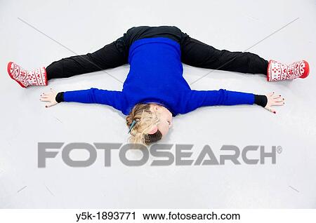 Tilburg, Netherlands. A professional dancer and choreographer of modern dance busy stretching and straightening her muscles before a rehearsal of improvised, modern dance. View Large Photo Image Stock Image - Tilburg, Netherlands. A professional dancer and choreographer of modern dance busy stretching and straightening her muscles before a rehearsal of improvised, modern dance.. Fotosearch