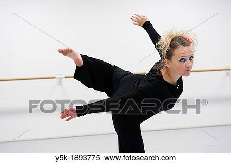 Tilburg, Netherlands. A professional dancer and choreographer of modern dance during a rehearsal of improvised, modern dance. View Large Photo Image Stock Photography - Tilburg, Netherlands. A professional dancer and choreographer of modern dance during a rehearsal of improvised, modern dance.. Fotosearch