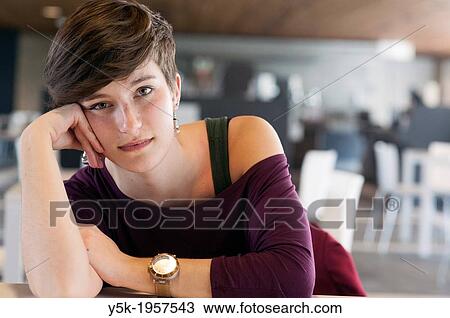 Tilburg, Netherlands. Portrait of a young brunette Philosophy student at Tilburg University, having a break in one of the coffee rooms in the main building. View Large Photo Image Stock Image - Tilburg, Netherlands. Portrait of a young brunette Philosophy student at Tilburg University, having a break in one of the coffee rooms in the main building.. Fotosearch