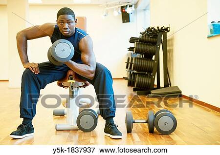 Tilburg, Netherlands Young African-American man working out in the gym View Large Photo Image Stock Photo - Tilburg, Netherlands Young African-American man working out in the gym. Fotosearch