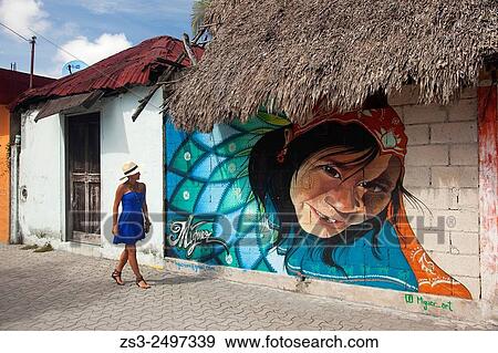 Stock Photo - Tourist woman wearing a Panama Hat walking at the streets of Tulum town, Quintana Roo, Yucatan Province, Mexico, Central America.. Fotosearch