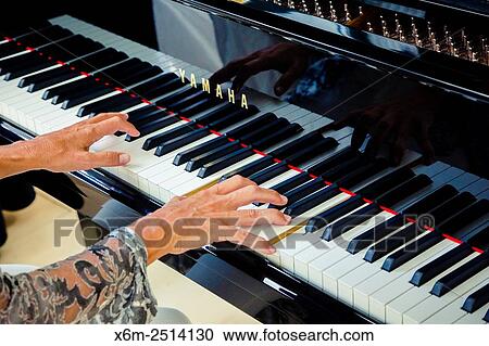 Woman playing the piano. View Large Photo Image Stock Image - Woman playing the piano.. Fotosearch