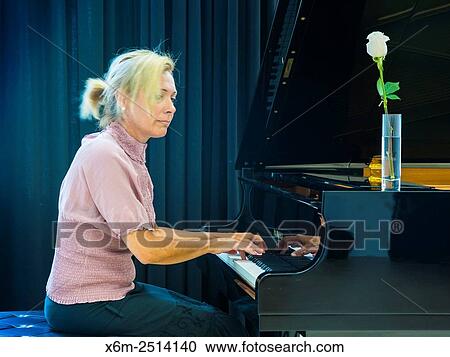 Woman playing the piano. View Large Photo Image Stock Image - Woman playing the piano.. Fotosearch