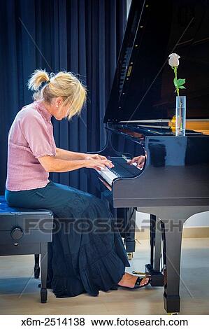 Woman playing the piano. View Large Photo Image Stock Photo - Woman playing the piano.. Fotosearch