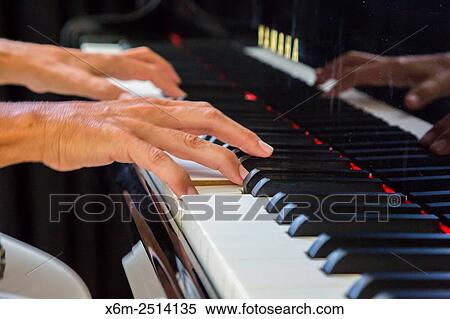 Woman playing the piano. View Large Photo Image Stock Photography - Woman playing the piano.. Fotosearch
