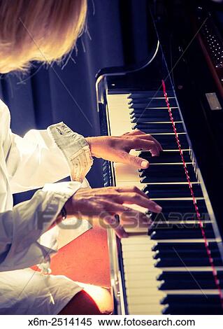 Woman playing the piano. View Large Photo Image Stock Photography - Woman playing the piano.. Fotosearch