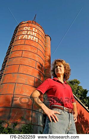 woman standing in front of silo at the Old Oak Farm in rural Massachusetts, a strickly organic operation. mr# 6110. View Large Photo Image Stock Photo - woman standing in front of silo at the Old Oak Farm in rural Massachusetts, a strickly organic operation. mr# 6110.. Fotosearch